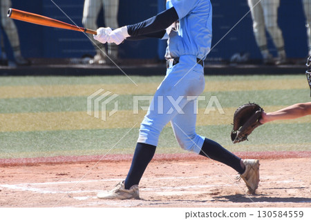 Batter hitting the ball 130584559