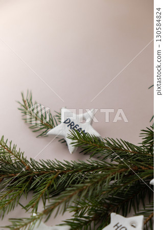 Christmas star with word DREAM Group of air dry clay handmade Christmas decor on beige background. Children air dry clay activity handicraft idea. Preparing for Christmas holiday decorating. Modern 130584824