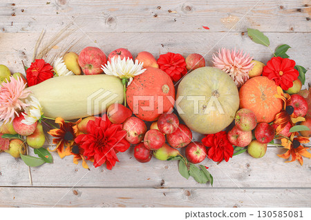 Happy Thanksgiving concept, postcard Autumn background with seasonal pears, pumpkins, apples and flowers on wooden background, copy space, selective focus. Harvesting, gifts of nature Happy Thanksgiving concept, postcard Autumn background with seasonal pears, pumpkins, apples and flowers on wooden background, copy space, selective focus. Harvesting, gifts of nature 130585081