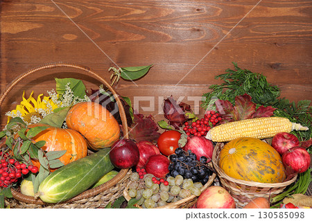Thanksgiving, autumn background with seasonal autumn nature berries, pumpkins, apples and flowers on a wooden background, copy space, Happy Thanksgiving concept, selective focus. 130585098