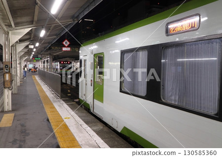Hachiko Line Kiha 110 series train parked at Takasaki Station at night Hachiko Line Kiha 110 series train parked at Takasaki Station at night 130585360