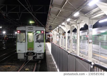 Hachiko Line Kiha 110 series train parked at Takasaki Station at night Hachiko Line Kiha 110 series train parked at Takasaki Station at night 130585362