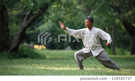 Senior man stretching in the park Senior man stretching in the park 130585737