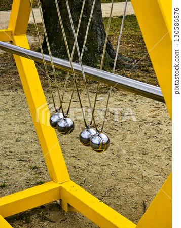Interactive Science Park Exhibit with Newton's Cradle, Plasma Balls and Physics Experiments Interactive Science Park Exhibit with Newton's Cradle, Plasma Balls and Physics Experiments 130586876