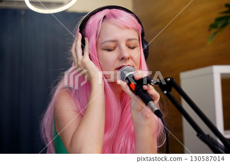 Beautiful young singer and musician broadcast from her home studio Beautiful young singer and musician broadcast from her home studio 130587014