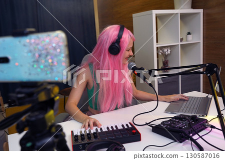 Beautiful young singer and musician broadcast from her home studio 130587016