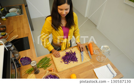 Young woman is broadcasting live from workshop how to prepare a vegetarian food 130587130