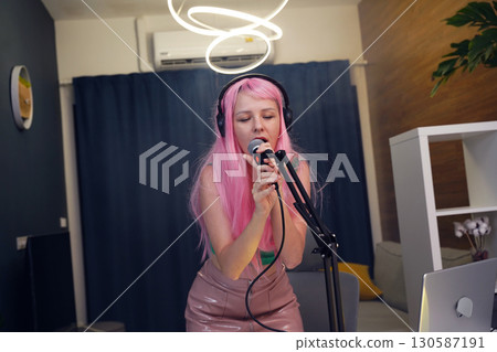 Beautiful young singer and musician broadcast from her home studio Beautiful young singer and musician broadcast from her home studio 130587191