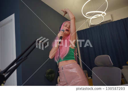 Beautiful young singer and musician broadcast from her home studio 130587203