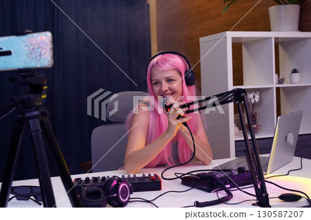 Beautiful young singer and musician broadcast from her home studio 130587207