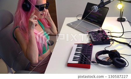 Beautiful young singer and musician broadcast from her home studio 130587227