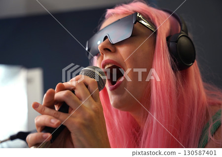 Beautiful young singer and musician broadcast from her home studio Beautiful young singer and musician broadcast from her home studio 130587401