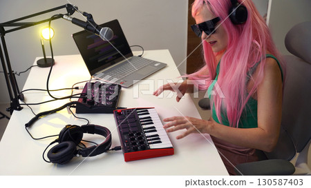 Beautiful young singer and musician broadcast from her home studio 130587403