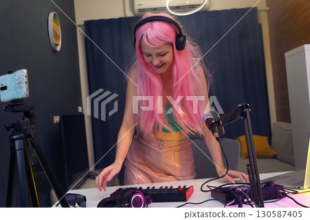 Beautiful young singer and musician broadcast from her home studio 130587405