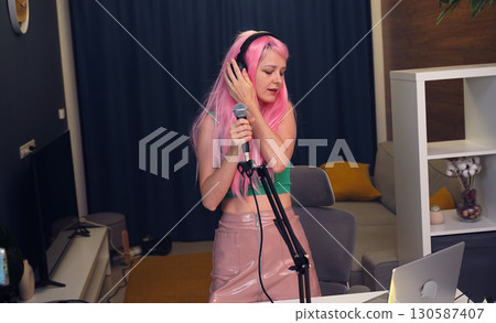 Beautiful young singer and musician broadcast from her home studio Beautiful young singer and musician broadcast from her home studio 130587407