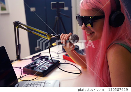 Beautiful young singer and musician broadcast from her home studio 130587429