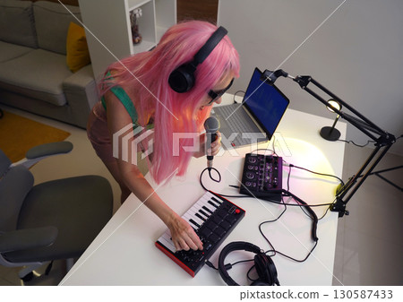 Beautiful young singer and musician broadcast from her home studio Beautiful young singer and musician broadcast from her home studio 130587433