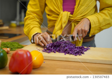 Young woman is broadcasting live from workshop how to prepare a vegetarian food Young woman is broadcasting live from workshop how to prepare a vegetarian food 130587483