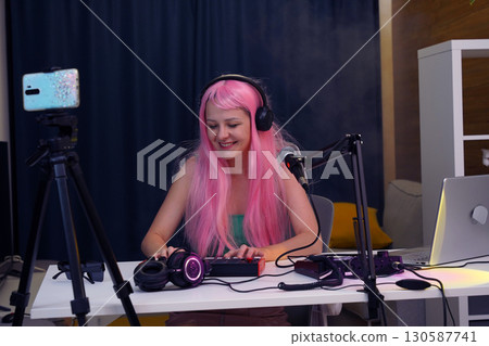 Beautiful young singer and musician broadcast from her home studio 130587741