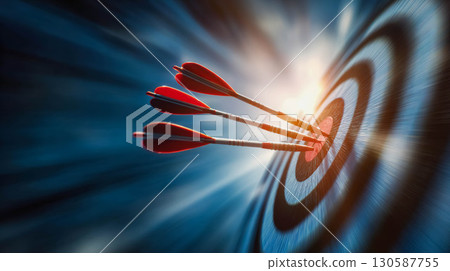 Red arrows striking a target in a dynamic motion blur, symbolizing focus and achievement 130587755