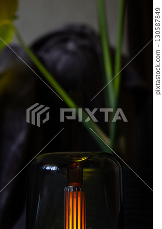 Indoors Decoration with modern lighted Air Humidification Aroma essential oil perfume fragrance. Scented home wellness wellbeing habit. Concept of feeling good spiritual health 130587849