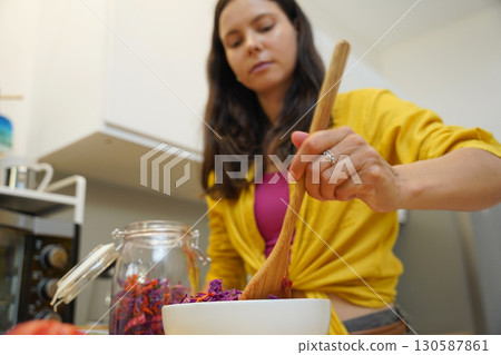 Young woman is broadcasting live from workshop how to prepare a vegetarian food 130587861