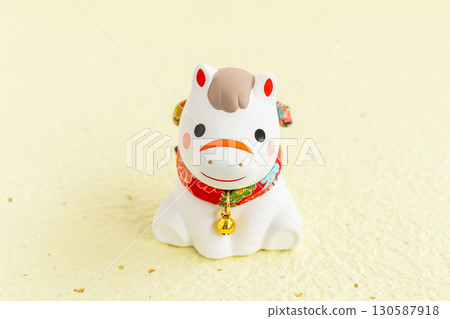 Cute New Year's card material for the Year of the Horse: Horse figurine on a yellow background 130587918