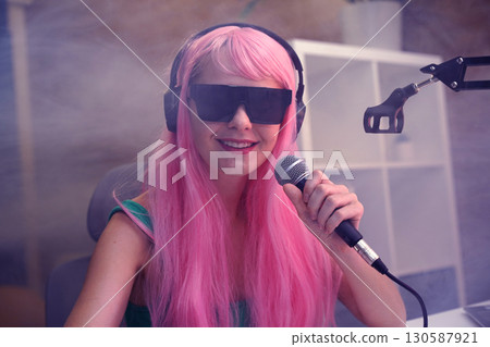 Beautiful young singer and musician broadcast from her home studio 130587921