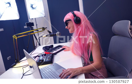 Beautiful young singer and musician broadcast from her home studio 130587927