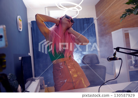 Beautiful young singer and musician broadcast from her home studio 130587929