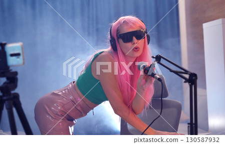 Beautiful young singer and musician broadcast from her home studio 130587932