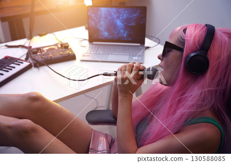 Beautiful young singer and musician broadcast from her home studio 130588085