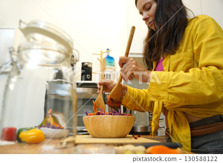 Young woman is broadcasting live from workshop how to prepare a vegetarian food 130588122