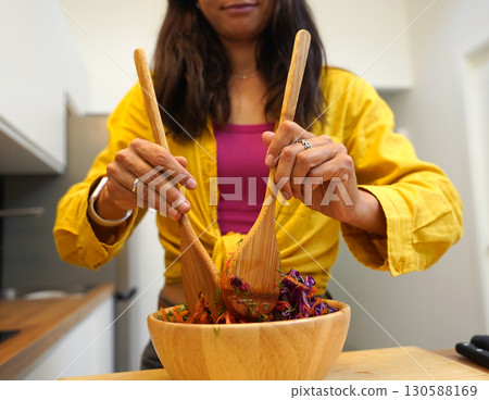 Young woman is broadcasting live from workshop how to prepare a vegetarian food 130588169