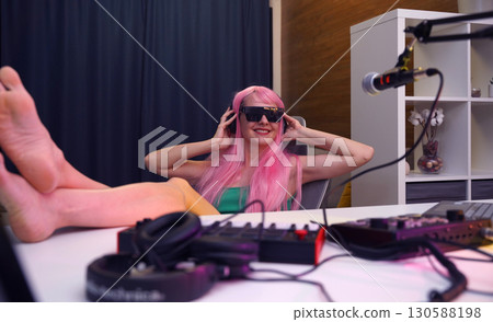 Beautiful young singer and musician broadcast from her home studio 130588198