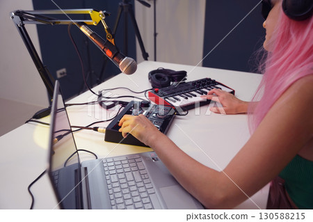 Beautiful young singer and musician broadcast from her home studio 130588215