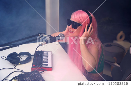Beautiful young singer and musician broadcast from her home studio 130588216