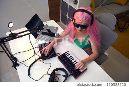 Beautiful young singer and musician broadcast from her home studio Beautiful young singer and musician broadcast from her home studio 130588220