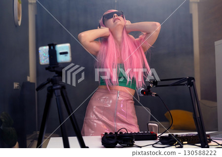 Beautiful young singer and musician broadcast from her home studio 130588222