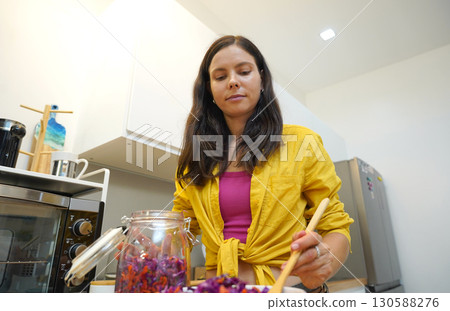 Young woman is broadcasting live from workshop how to prepare a vegetarian food Young woman is broadcasting live from workshop how to prepare a vegetarian food 130588276