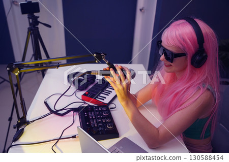 Beautiful young singer and musician broadcast from her home studio 130588454