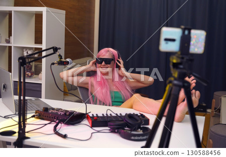 Beautiful young singer and musician broadcast from her home studio 130588456