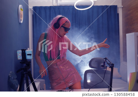 Beautiful young singer and musician broadcast from her home studio 130588458