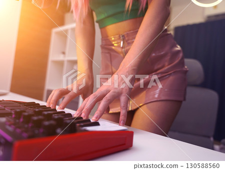 Beautiful young singer and musician broadcast from her home studio 130588560