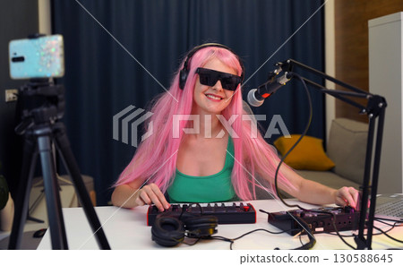 Beautiful young singer and musician broadcast from her home studio 130588645