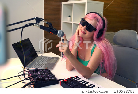 Beautiful young singer and musician broadcast from her home studio 130588795