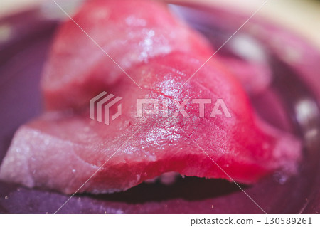 Fresh Sashimi Featuring Glazed Pieces on a Ceramic Plate 130589261
