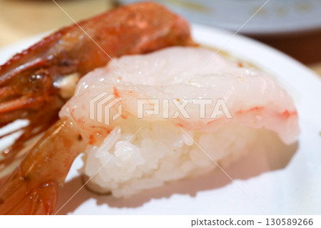 Fresh Nigiri Sushi with Sweet Shrimp and Grilled Head on Plate Fresh Nigiri Sushi with Sweet Shrimp and Grilled Head on Plate 130589266