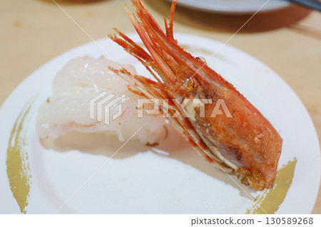 Fresh Nigiri Sushi with Sweet Shrimp and Grilled Head on Plate 130589268
