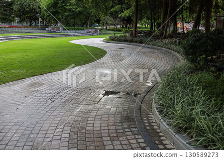 Pathway Through a Green Park in a Peaceful Urban Area 130589273